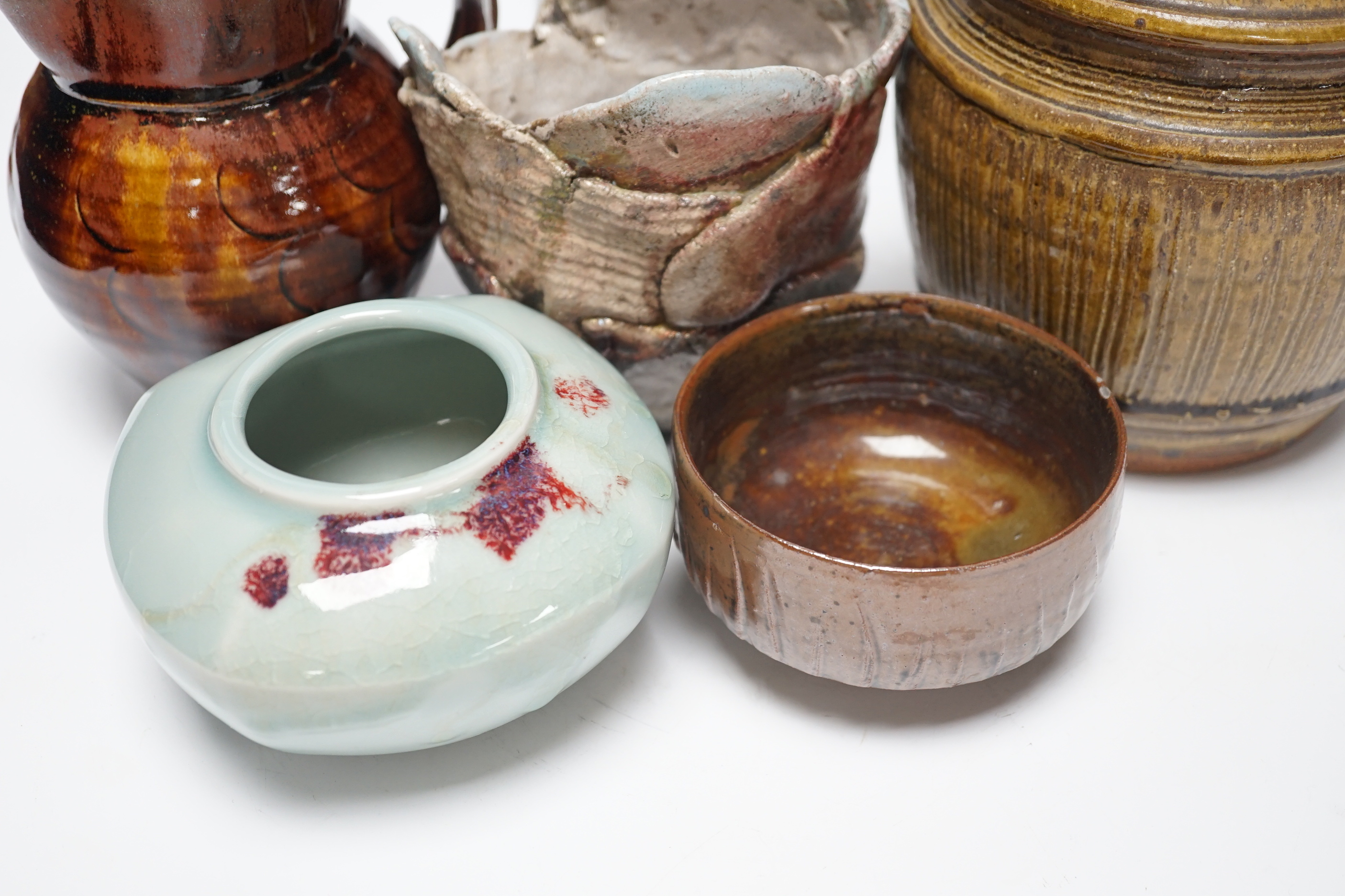 Studio ceramics to include a St. Ives moulded jug and an ash glazed jar and cover marked 'MD' etc. St Ives jug 15cm high